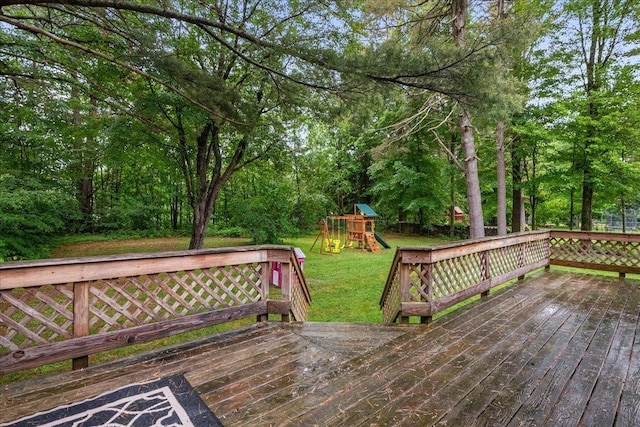 155 Woodcrest Cir, Milton, VT 05468 - wooden deck with a lawn, a playground, and view of scattered trees