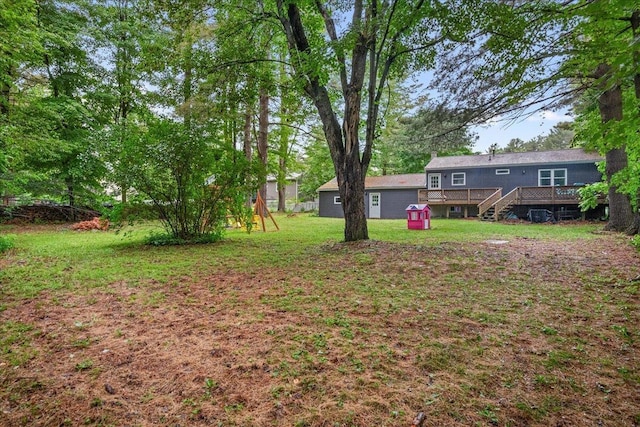 155 Woodcrest Cir, Milton, VT 05468 - view of green lawn with a wooden deck and a playground