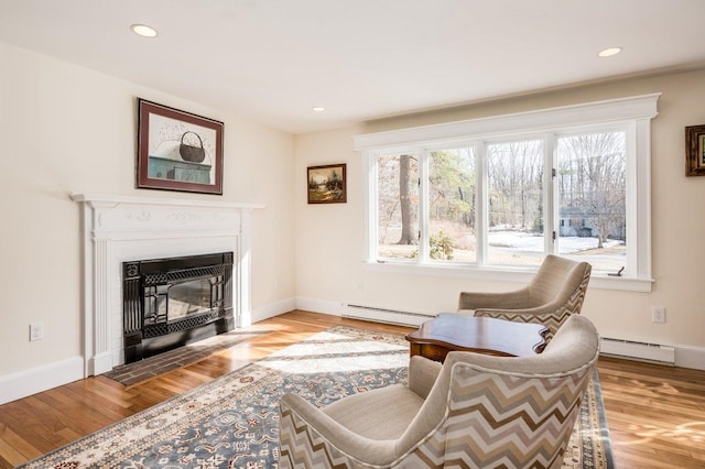 8 Woodridge Rd, Durham, NH 03824 - sitting room featuring a baseboard radiator, healthy amount of natural light, wood finished floors, and recessed lighting