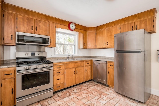 8 Woodridge Rd, Durham, NH 03824 - kitchen with appliances with stainless steel finishes, brown cabinets, and light countertops