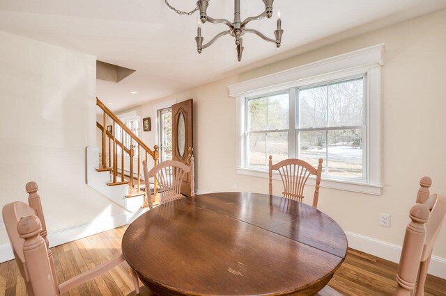 8 Woodridge Rd, Durham, NH 03824 - dining room with wood finished floors, a chandelier, stairs, and recessed lighting