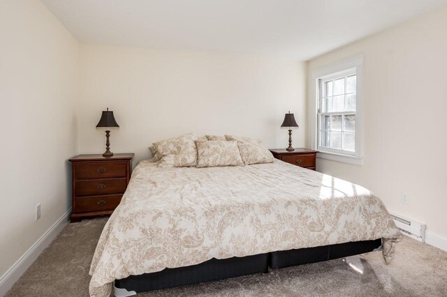 8 Woodridge Rd, Durham, NH 03824 - carpeted bedroom with a baseboard heating unit and baseboards