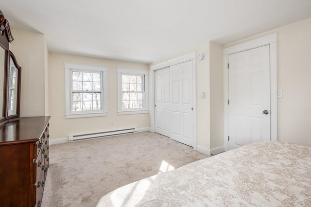 8 Woodridge Rd, Durham, NH 03824 - unfurnished bedroom featuring a baseboard radiator, carpet, and a closet