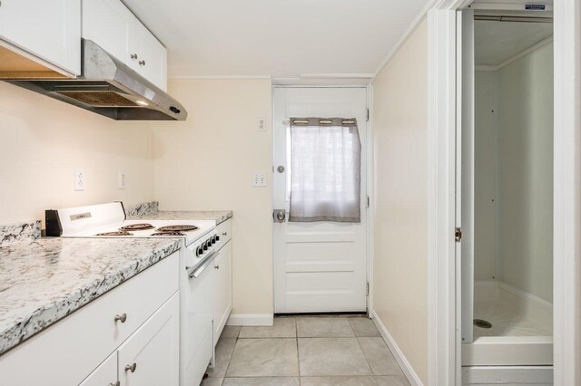 8 Woodridge Rd, Durham, NH 03824 - kitchen featuring white range with electric stovetop, under cabinet range hood, white cabinetry, light tile patterned flooring, and light stone countertops
