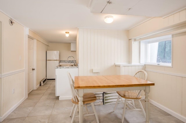 8 Woodridge Rd, Durham, NH 03824 - dining space with light tile patterned flooring and a wainscoted wall