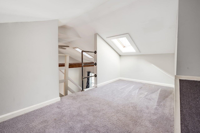 8 Woodridge Rd, Durham, NH 03824 - additional living space with a skylight, lofted ceiling, and carpet floors