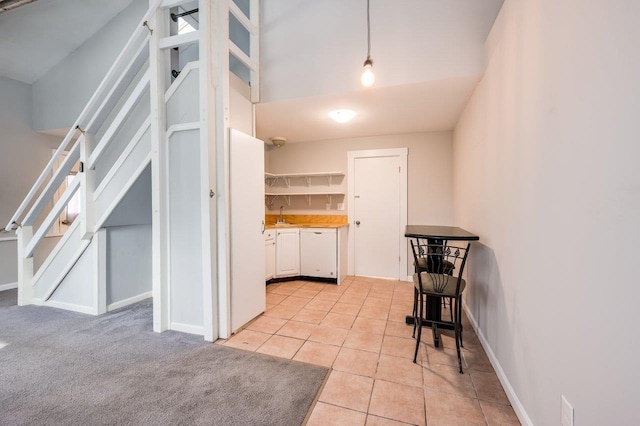8 Woodridge Rd, Durham, NH 03824 - kitchen featuring white cabinetry, light tile patterned floors, white dishwasher, open shelves, and light countertops