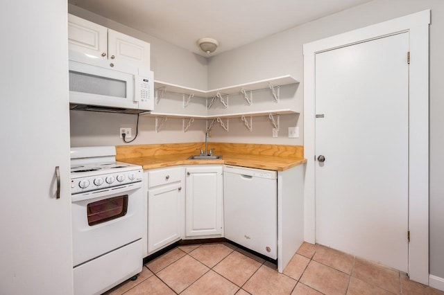 8 Woodridge Rd, Durham, NH 03824 - kitchen with white appliances, open shelves, white cabinetry, light tile patterned flooring, and wood counters