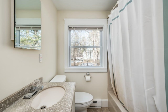 8 Woodridge Rd, Durham, NH 03824 - bathroom featuring baseboard heating, healthy amount of natural light, vanity, and shower / bathtub combination with curtain