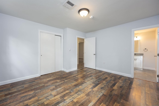 222 Daniel Webster Hwy, Boscawen, NH 03303 - unfurnished bedroom with dark wood finished floors and a closet