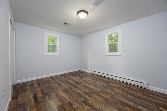 222 Daniel Webster Hwy, Boscawen, NH 03303 - unfurnished bedroom featuring baseboard heating, multiple windows, and wood finished floors