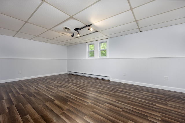 222 Daniel Webster Hwy, Boscawen, NH 03303 - empty room with a baseboard radiator, dark wood-style flooring, and a paneled ceiling