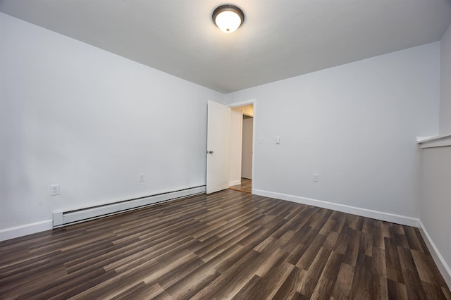 222 Daniel Webster Hwy, Boscawen, NH 03303 - empty room featuring a baseboard heating unit and dark wood finished floors