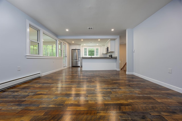 222 Daniel Webster Hwy, Boscawen, NH 03303 - unfurnished living room with dark wood finished floors, recessed lighting, and baseboard heating