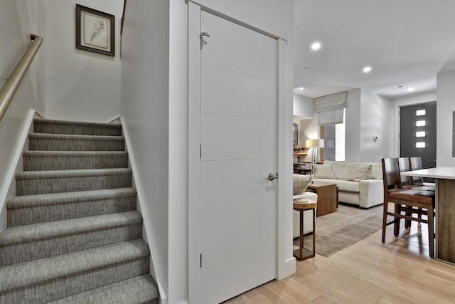 144 Lodge Rd Unit 5, Ludlow, VT 05149 - staircase with wood finished floors and recessed lighting