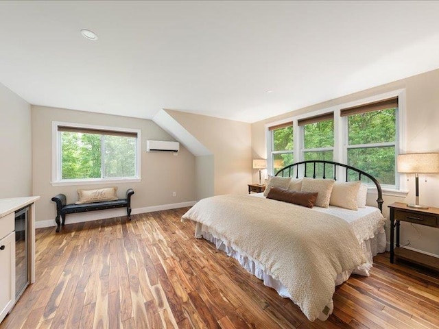 71 Marblehead Rd, Windham, NH 03087 - bedroom featuring an AC wall unit, light wood-style floors, and wine cooler