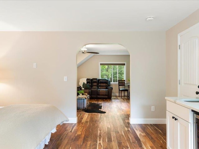 71 Marblehead Rd, Windham, NH 03087 - hallway with arched walkways, wood finished floors, and wine cooler
