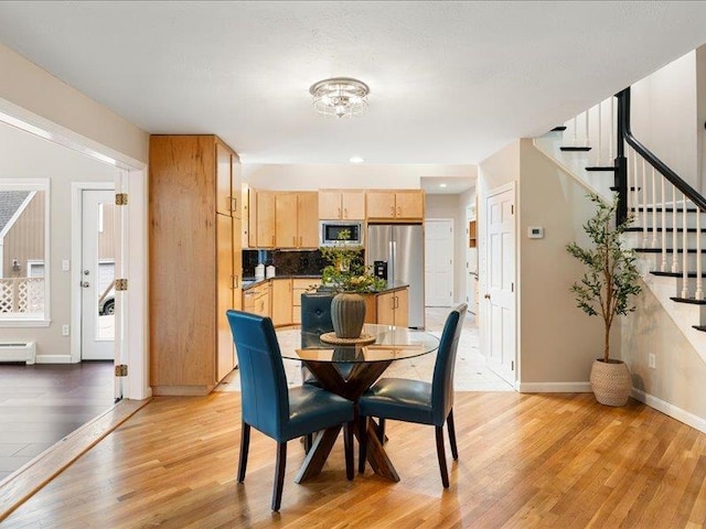 71 Marblehead Rd, Windham, NH 03087 - dining space with light wood finished floors, stairway, and baseboard heating