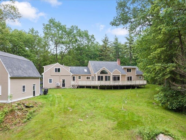 71 Marblehead Rd, Windham, NH 03087 - back of property featuring a lawn, a deck, and a chimney
