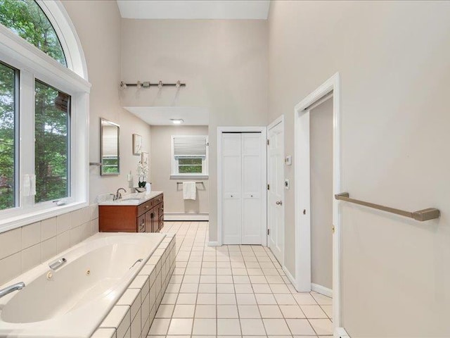 71 Marblehead Rd, Windham, NH 03087 - full bath featuring baseboard heating, vanity, a whirlpool tub, a high ceiling, and tile patterned floors