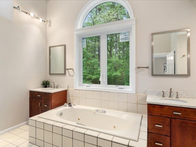 71 Marblehead Rd, Windham, NH 03087 - full bathroom with two vanities, a whirlpool tub, and tile patterned floors