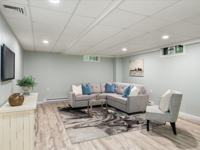 71 Marblehead Rd, Windham, NH 03087 - living area with a baseboard radiator, wood finished floors, recessed lighting, and a drop ceiling