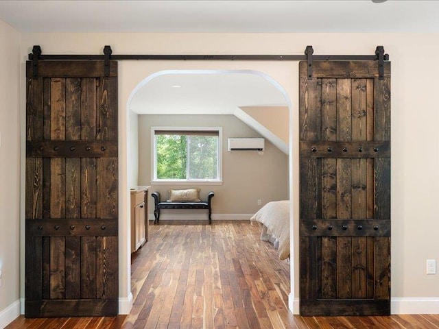 71 Marblehead Rd, Windham, NH 03087 - hall with a barn door, a wall unit AC, and wood finished floors