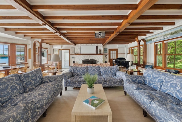 68 Sewall Rd, Wolfeboro, NH 03894 - living room with carpet flooring, beam ceiling, and a fireplace