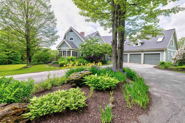 650 Perry Lea Rd, Waterbury, VT 05676 - view of front of home featuring driveway, an attached garage, and a shingled roof