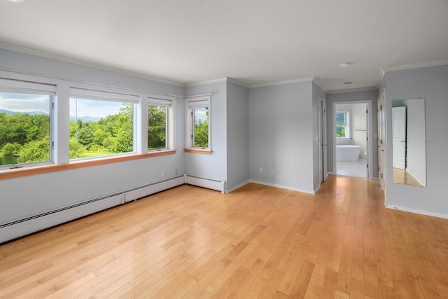 650 Perry Lea Rd, Waterbury, VT 05676 - empty room featuring light wood-type flooring, a baseboard radiator, and ornamental molding