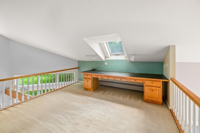 650 Perry Lea Rd, Waterbury, VT 05676 - unfurnished office featuring baseboard heating, a skylight, track lighting, light colored carpet, and healthy amount of natural light