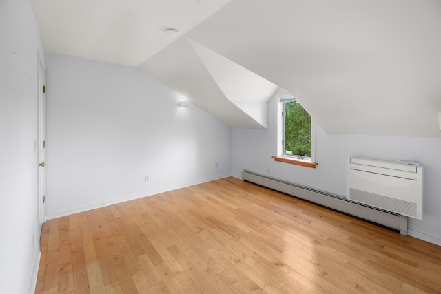 650 Perry Lea Rd, Waterbury, VT 05676 - bonus room featuring a baseboard heating unit, hardwood / wood-style floors, and lofted ceiling