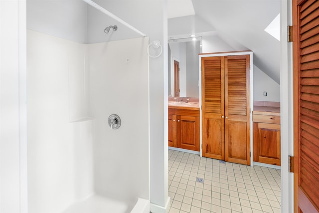 650 Perry Lea Rd, Waterbury, VT 05676 - bathroom featuring lofted ceiling, a shower, tile patterned flooring, and vanity