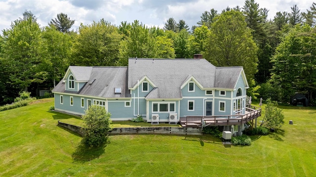 650 Perry Lea Rd, Waterbury, VT 05676 - back of house featuring a deck, a yard, roof with shingles, and a chimney