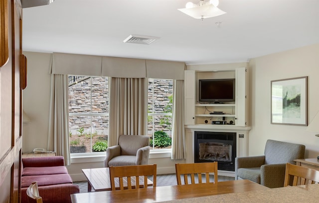517-519 Jackson Gore Rd Unit 517-519Qtr I, Ludlow, VT 05149 - dining space with a glass covered fireplace