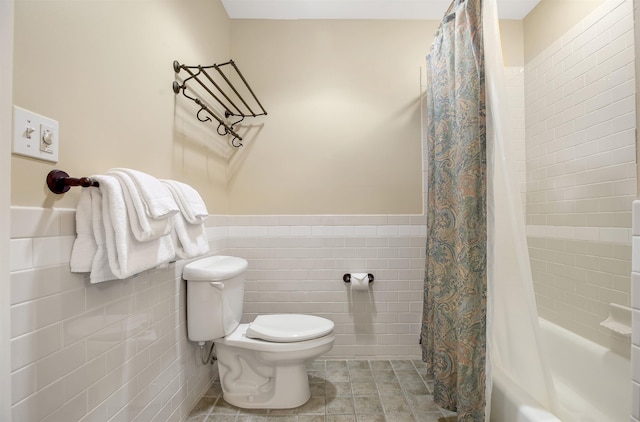 517-519 Jackson Gore Rd Unit 517-519Qtr I, Ludlow, VT 05149 - bathroom featuring tile walls, shower / tub combo with curtain, wainscoting, and tile patterned flooring