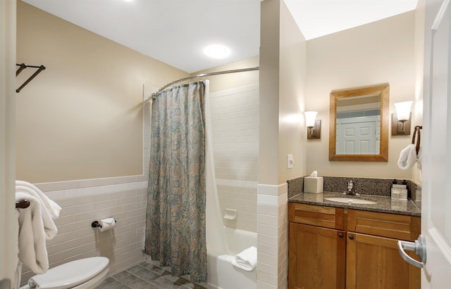 517-519 Jackson Gore Rd Unit 517-519Qtr I, Ludlow, VT 05149 - bathroom featuring tile walls, vanity, shower / bath combo with shower curtain, tile patterned flooring, and wainscoting