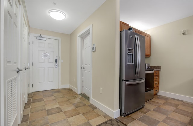517-519 Jackson Gore Rd Unit 517-519Qtr I, Ludlow, VT 05149 - kitchen featuring appliances with stainless steel finishes, brown cabinetry, and stone finish flooring