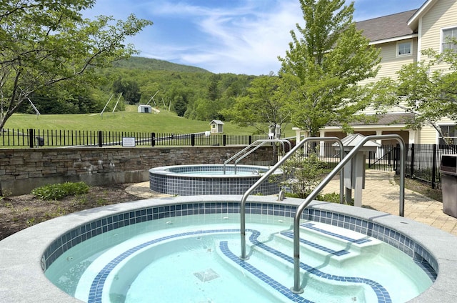 517-519 Jackson Gore Rd Unit 517-519Qtr I, Ludlow, VT 05149 - view of pool featuring a hot tub and a swimming pool