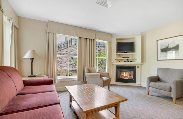 517-519 Jackson Gore Rd Unit 517-519Qtr I, Ludlow, VT 05149 - carpeted living area featuring a glass covered fireplace and baseboards