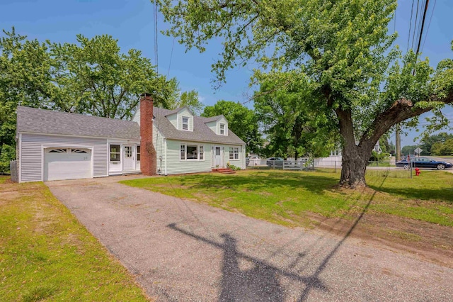 10 Eastern Ave, Rochester, NH 03867 - new england style home featuring a garage, a chimney, and asphalt driveway