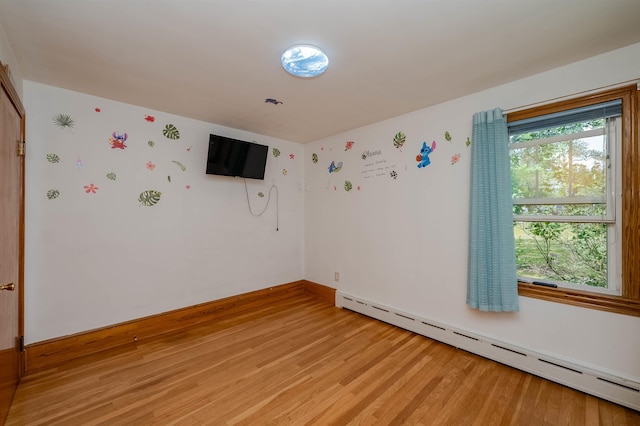 10 Eastern Ave, Rochester, NH 03867 - spare room with baseboard heating, light wood finished floors, and wallpapered walls