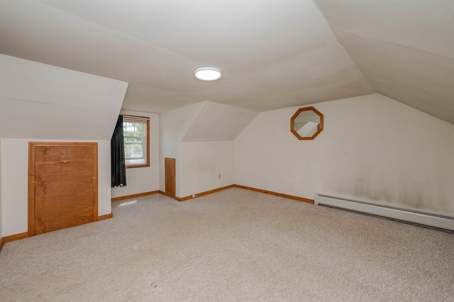 10 Eastern Ave, Rochester, NH 03867 - additional living space with lofted ceiling, light colored carpet, and a baseboard radiator