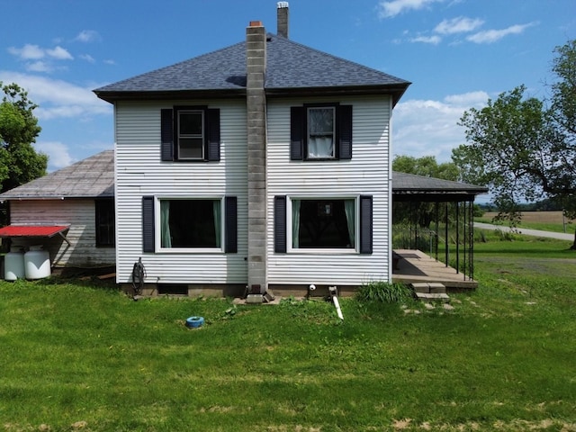 180 E Shore S, Grand Isle, VT 05458 - back of property featuring roof with shingles, a lawn, and a chimney