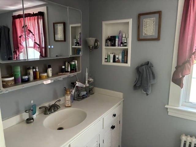 649 Court St, Keene, NH 03431 - bathroom featuring vanity and radiator