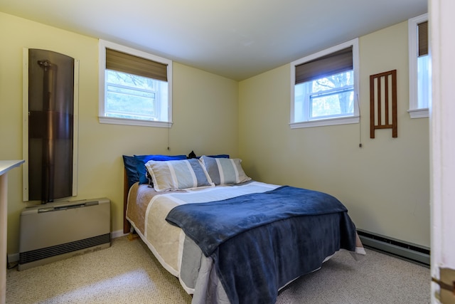 45 Kancamagus Hwy Unit 2, Woodstock, NH 03262 - carpeted bedroom with a baseboard heating unit and multiple windows
