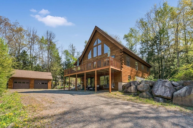 67 Cardinal Ln, Smithfield, ME 04978 - view of front facade featuring a wooden deck, a garage, an outdoor structure, and log siding