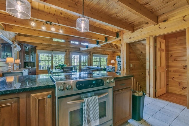 67 Cardinal Ln, Smithfield, ME 04978 - kitchen featuring stainless steel range with electric cooktop, wooden walls, light tile patterned floors, a wooden ceiling with exposed beams, and pendant lighting