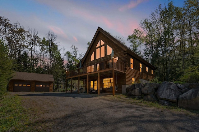 67 Cardinal Ln, Smithfield, ME 04978 - view of front of house featuring a garage, a deck, an outdoor structure, and log exterior