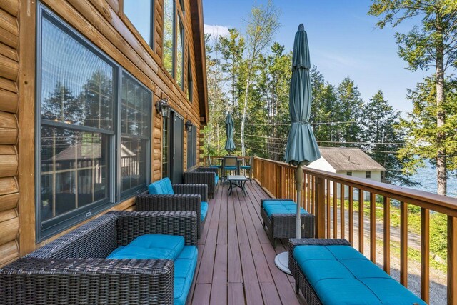 67 Cardinal Ln, Smithfield, ME 04978 - wooden terrace with outdoor dining space